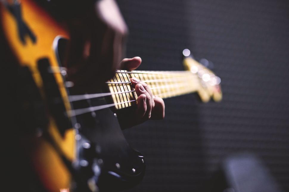 Free Image of Bassist playing an electric bass guitar 