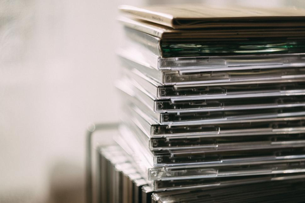 Free Image of Stack of CD cases in soft focus 