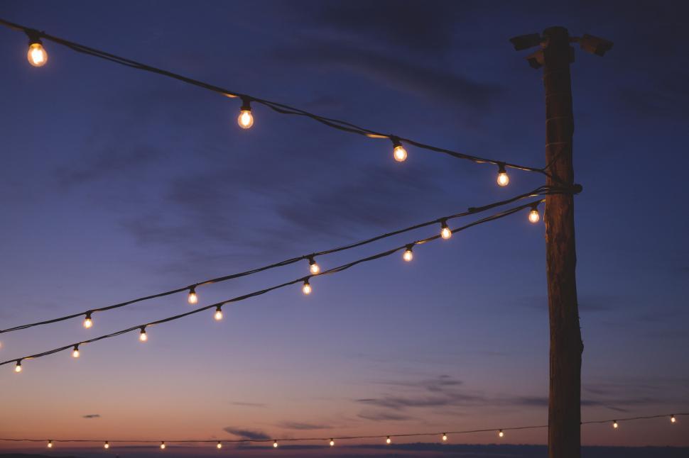 Free Image of Twilight sky with string of outdoor lights 