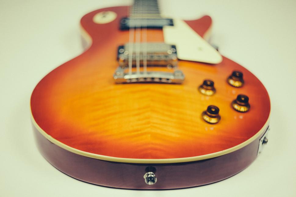 Free Image of Close-up of a Sunburst Electric Guitar 