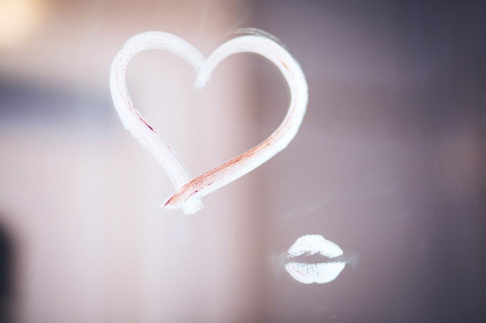 Free Image of Heart drawn in fog on glass and kiss lip imprint 