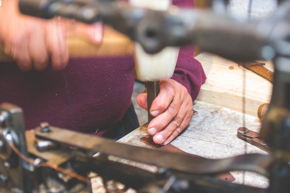 Free Image of Artisan shaping metal with a hammer 
