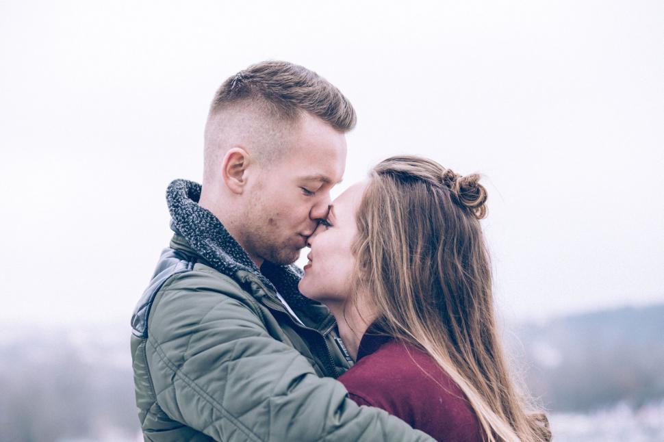 Free Image of Couple embracing in a winter setting 
