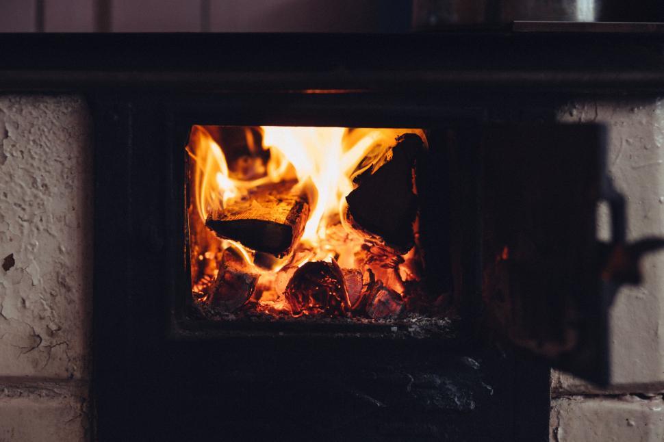 Free Image of Warm fireplace with burning logs close-up 