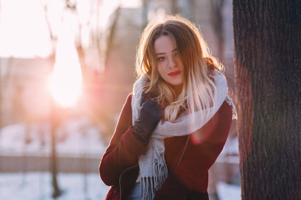 Free Image of Woman in sunlight during winter 