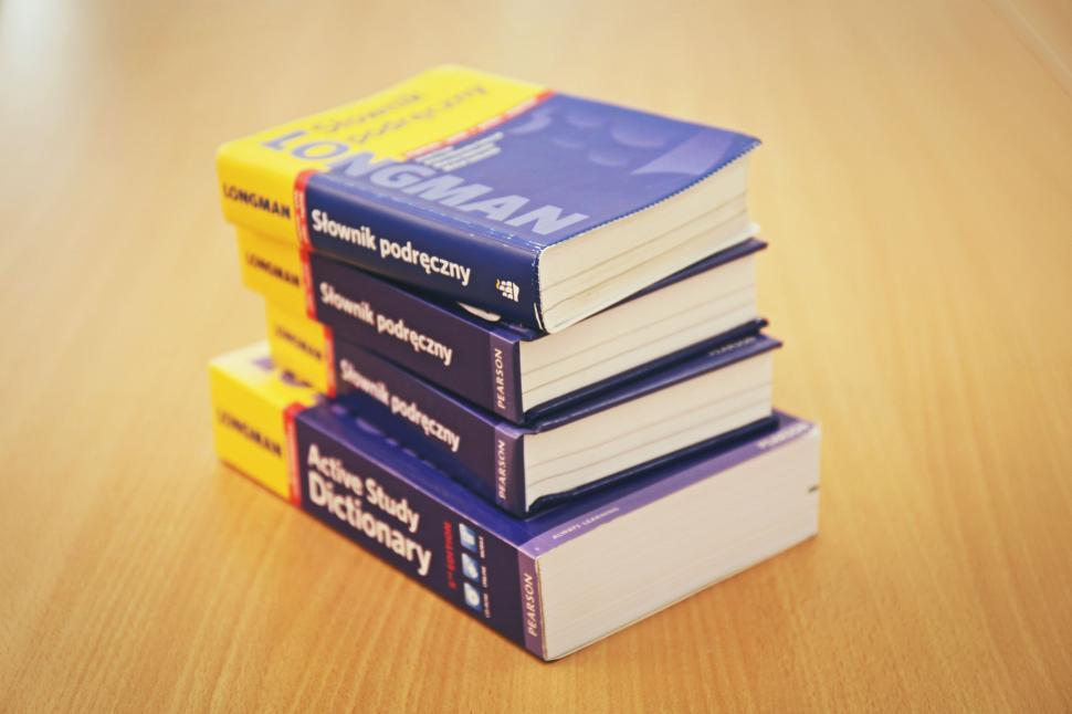 Free Image of Stack of dictionaries on a table 