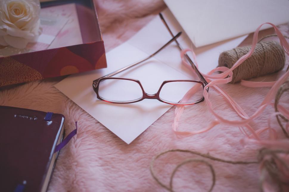 Free Image of Elegant glasses on a cozy workspace setting 