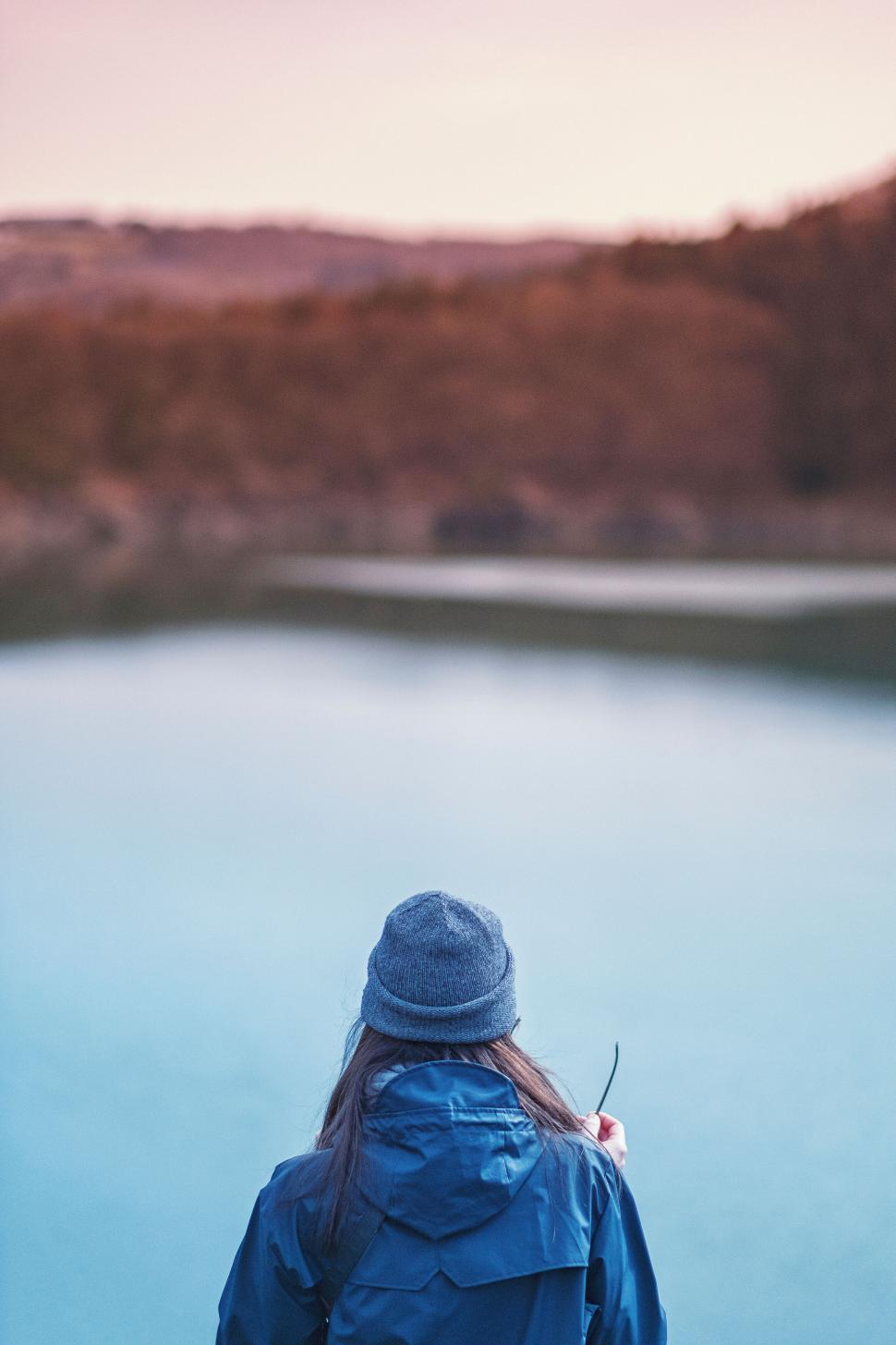 Free Image of Dreamy image of woman overlooking a tranquil lake 