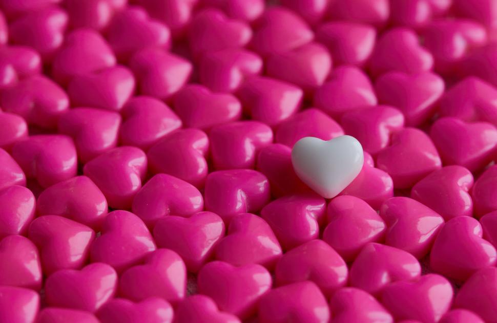 Free Image of Single White Heart Among Pink Hearts 