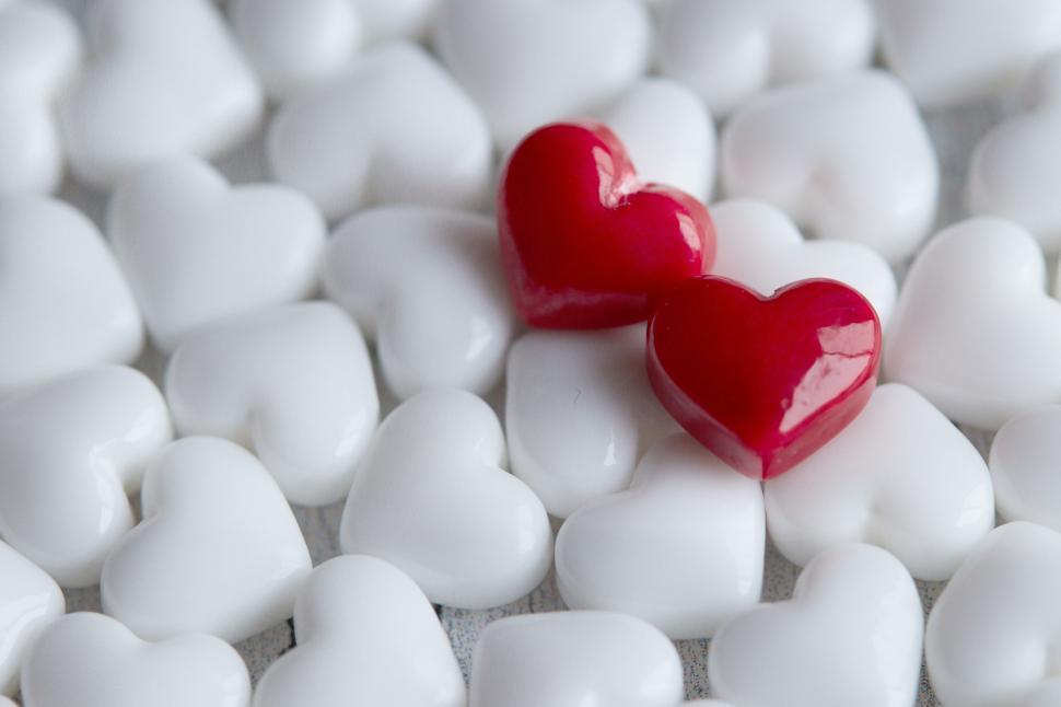 Free Image of Two red hearts among white, symbol of love 