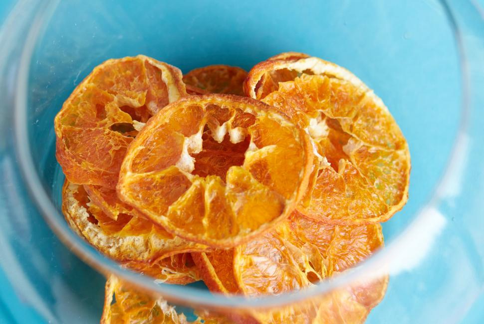 Free Image of Bowl of dried orange slices close up 