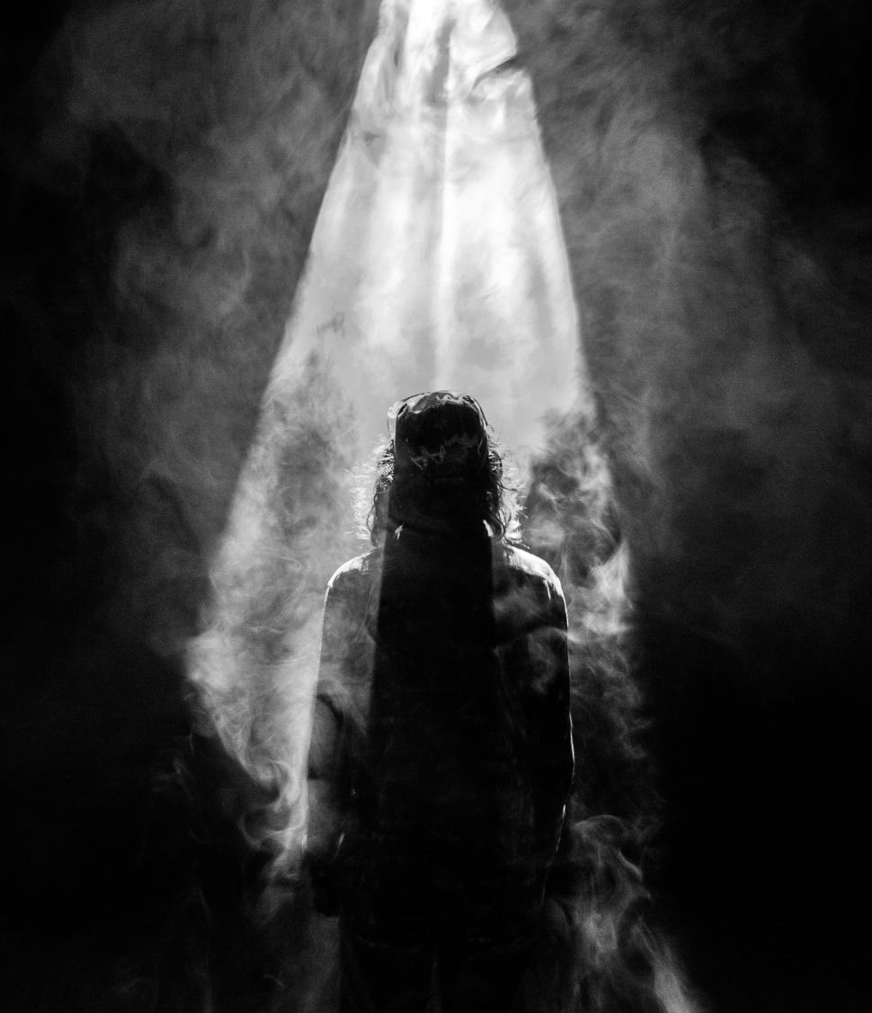 Free Image of Silhouette of a person with backlit smoke 