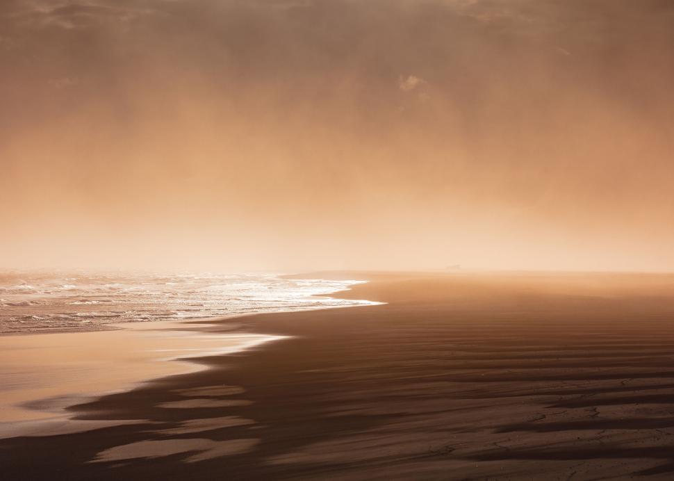 Free Image of Mystic beach scene with golden fog 