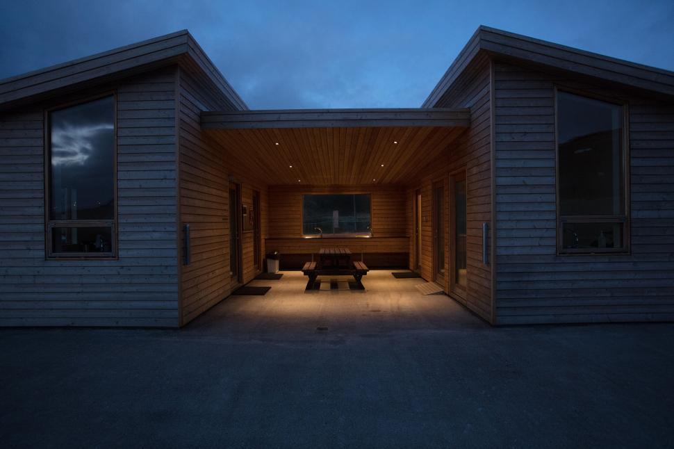 Free Image of Modern wooden cabins at twilight 