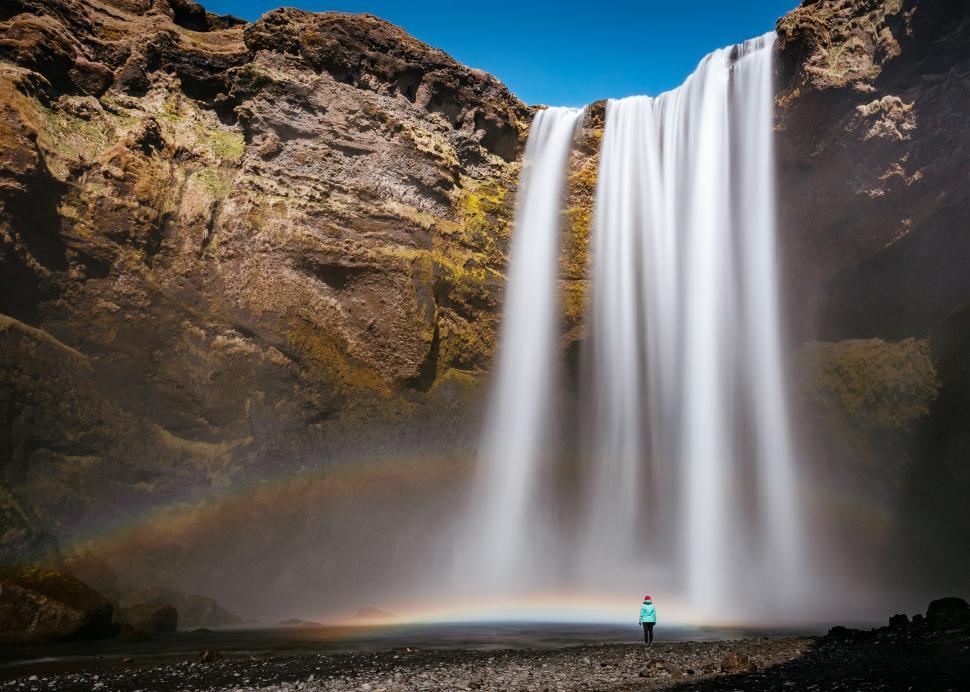 Free Image of Majestic waterfall with a rainbow in Iceland 
