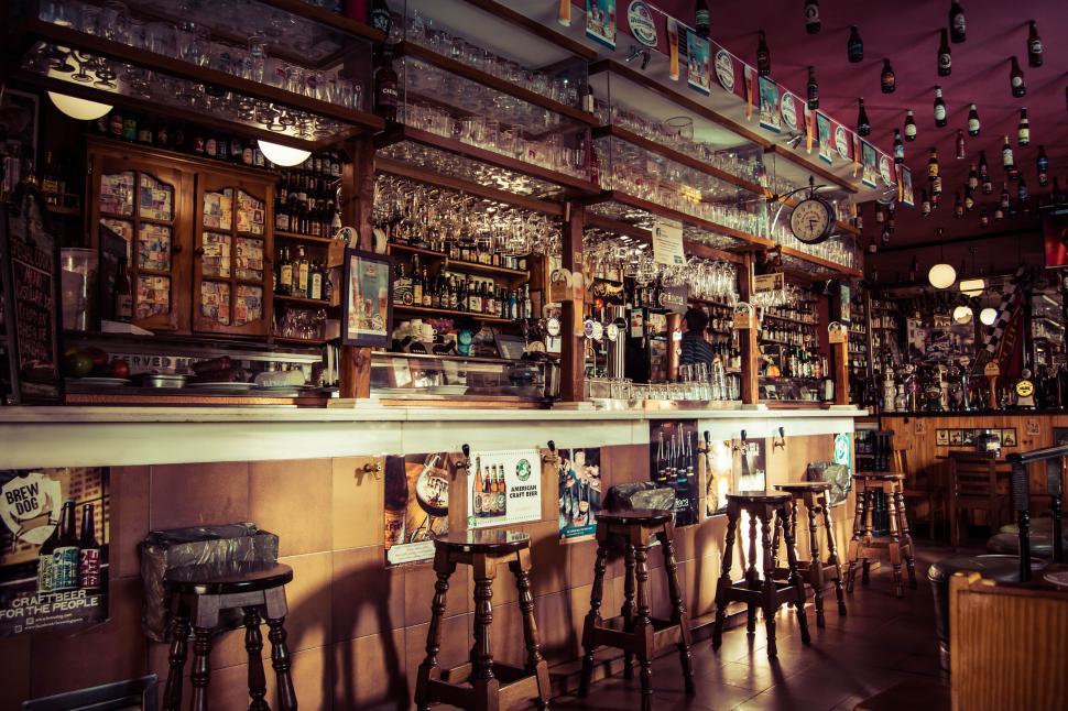 Free Image of Vintage pub interior with rich wood finishes 