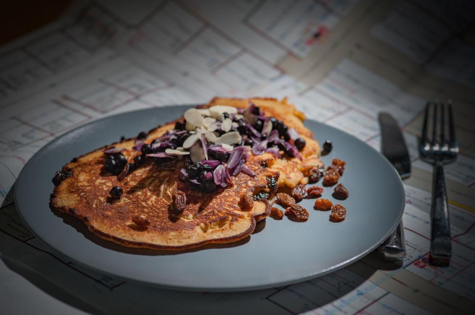 Free Image of Delicious pancakes served with purple toppings 