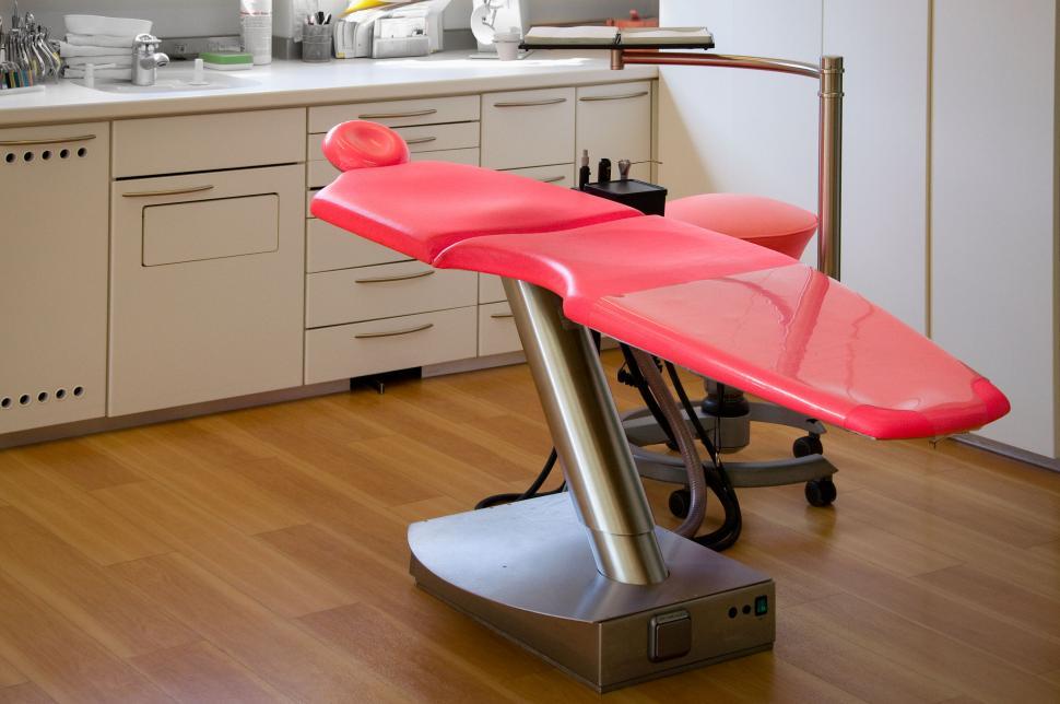 Free Image of Modern red medical examination table in clinic 
