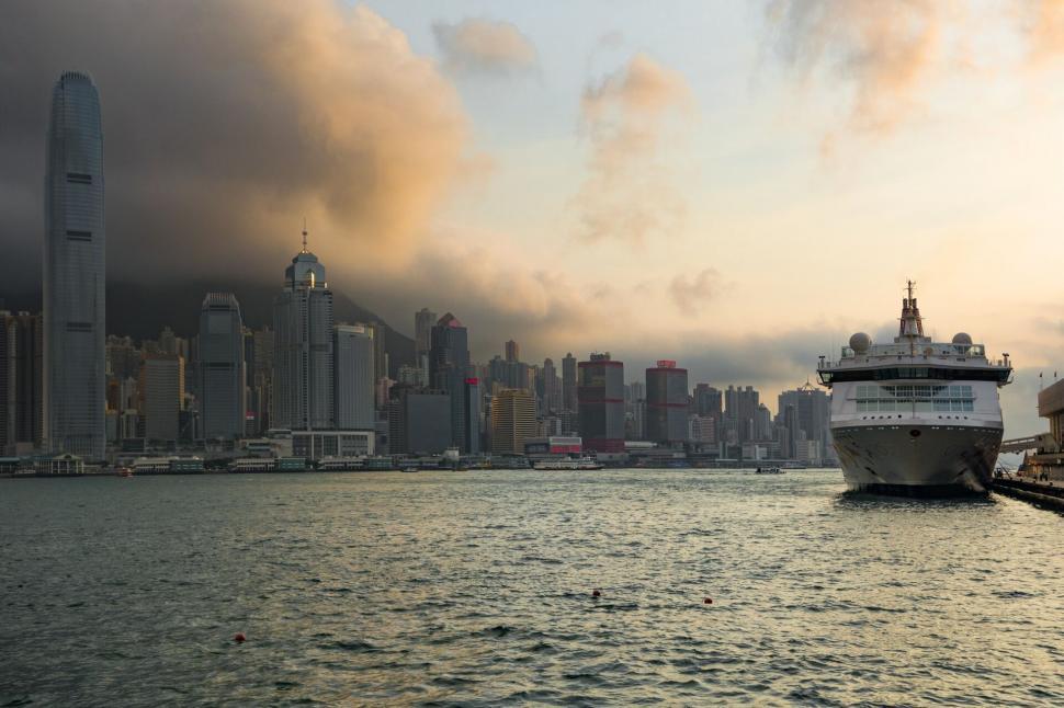 Free Image of Sunset over Hong Kong harbor with cruise ship 