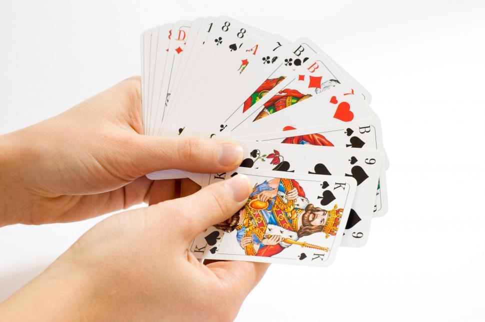 Free Image of Hand fan of assorted playing cards closeup 
