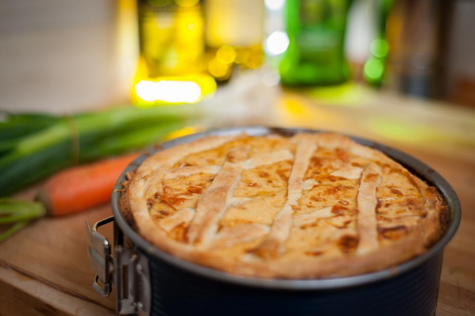 Free Image of Quiche in a tin on a wooden surface 