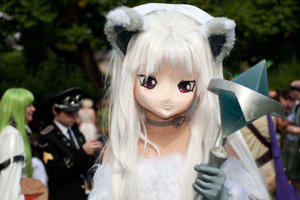 Free Image of Cosplayer with white wig and axe prop 