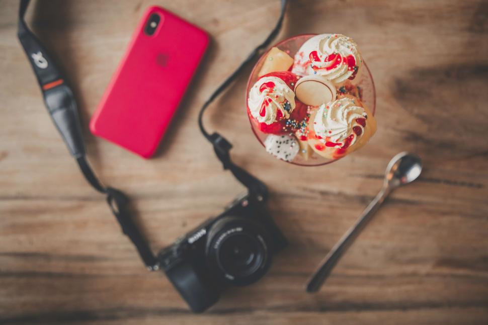 Free Image of Red velvet dessert with camera and phone 
