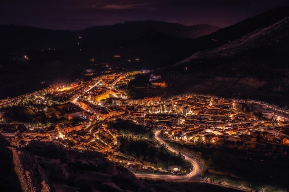 Free Image of Night view of a lit mountain town 