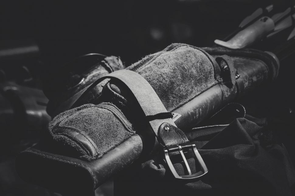 Free Image of B&ampW photo of equestrian gear on fence 