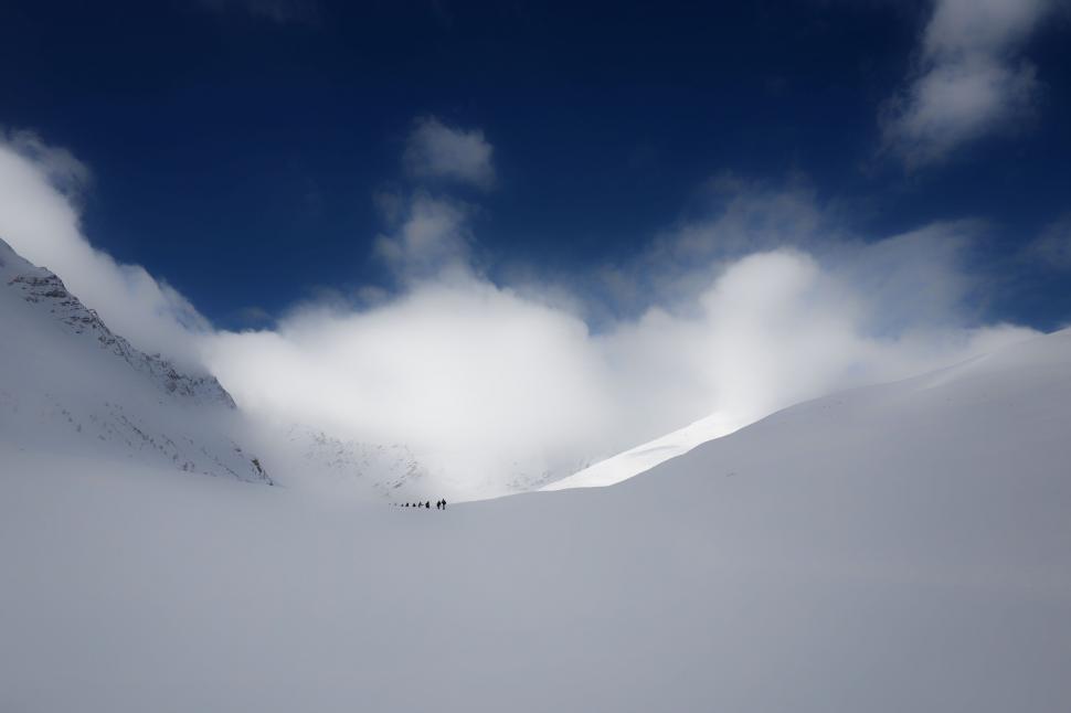 Free Image of Group of people in a snowy mountain pass 