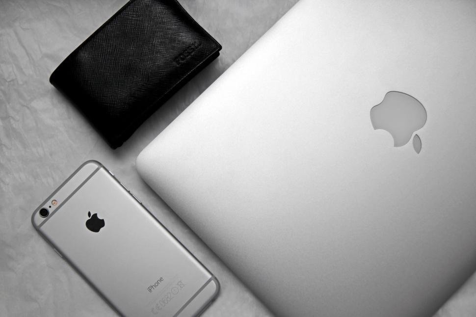 Free Image of Apple products and wallet on a table 