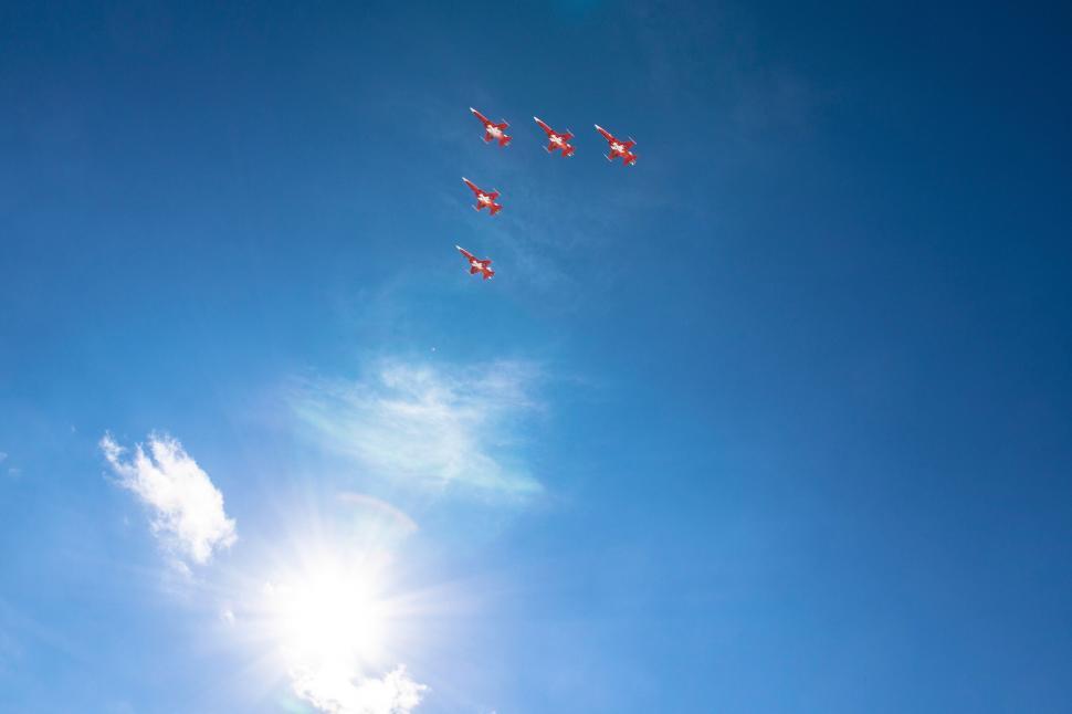 Free Image of Formation of jets flying against the sunny sky 