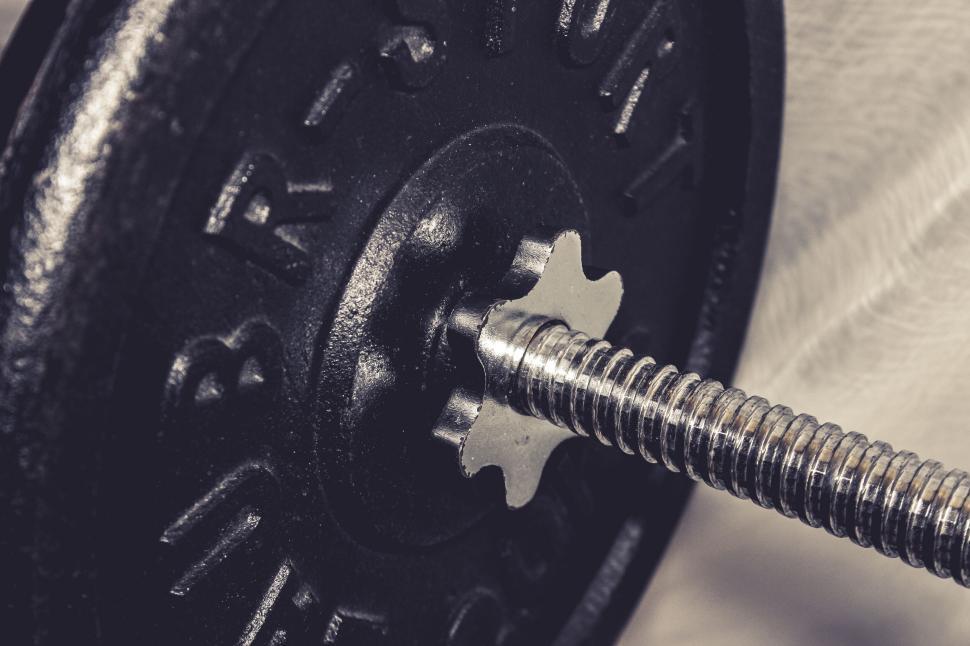 Free Image of Close-up of black weightlifting plate and bar 