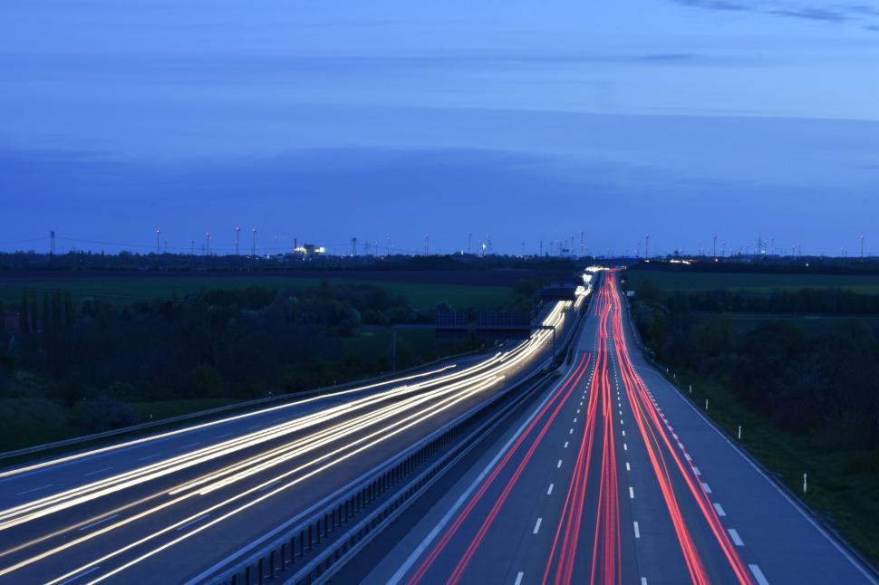 Free Image of Highway at night with light trails from cars 