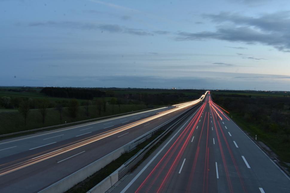 Free Image of Traffic flowing on highway during early evening 
