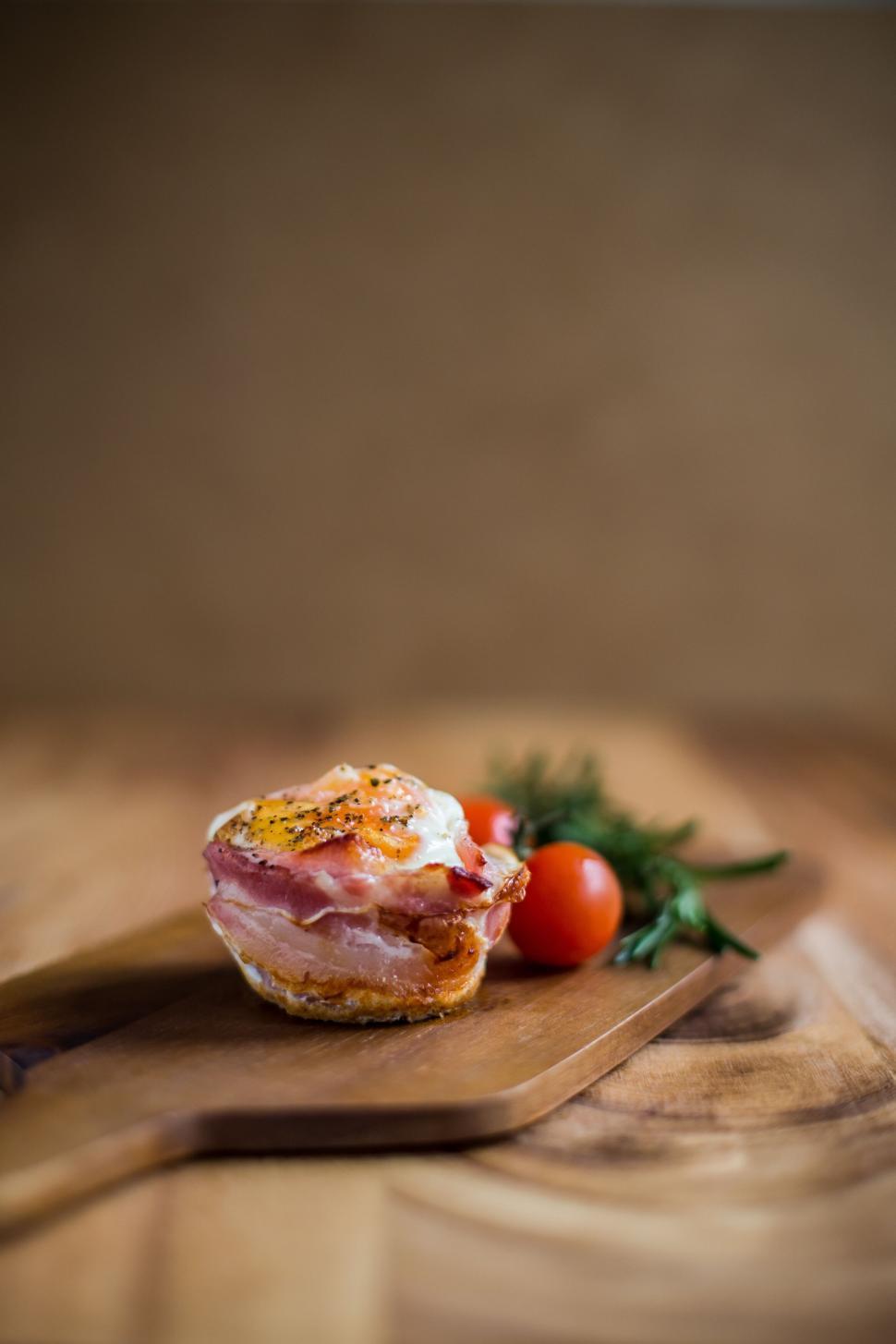 Free Image of Bacon and egg muffin on a wooden spatula 