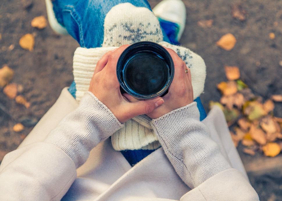 Free Image of Person holding a coffee mug in autumn 