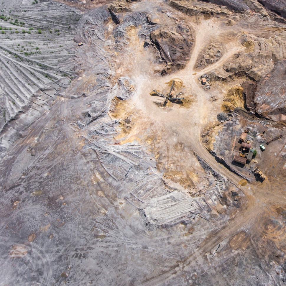 Free Image of Aerial view of excavator in a quarry pit 