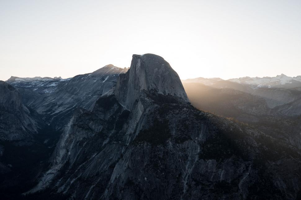 Free Image of Golden hour over a mountain peak 