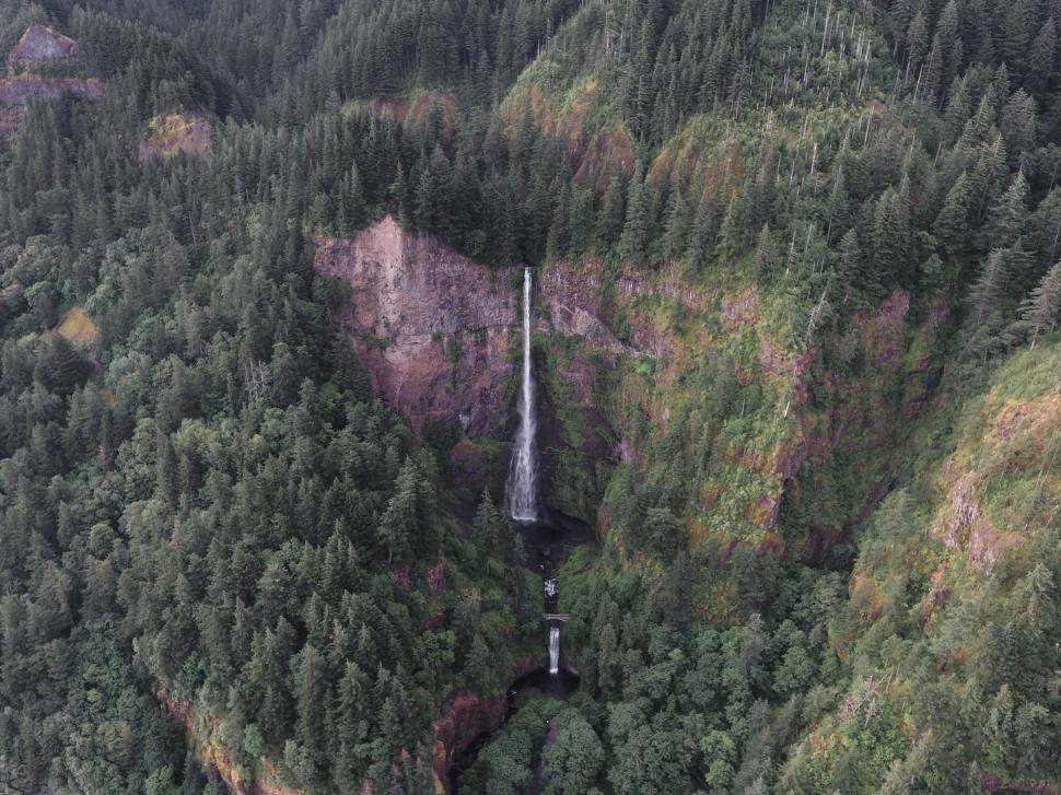 Free Image of Drone View of Waterfall Amidst Lush Greenery 
