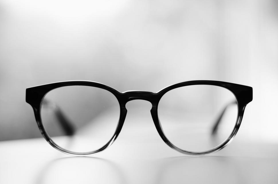 Free Image of Black eyeglasses on a white surface 