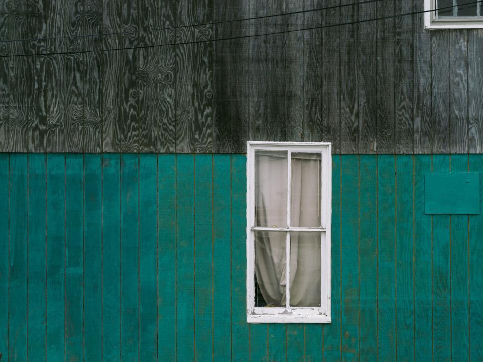 Free Image of Old green wooden wall with single white window 