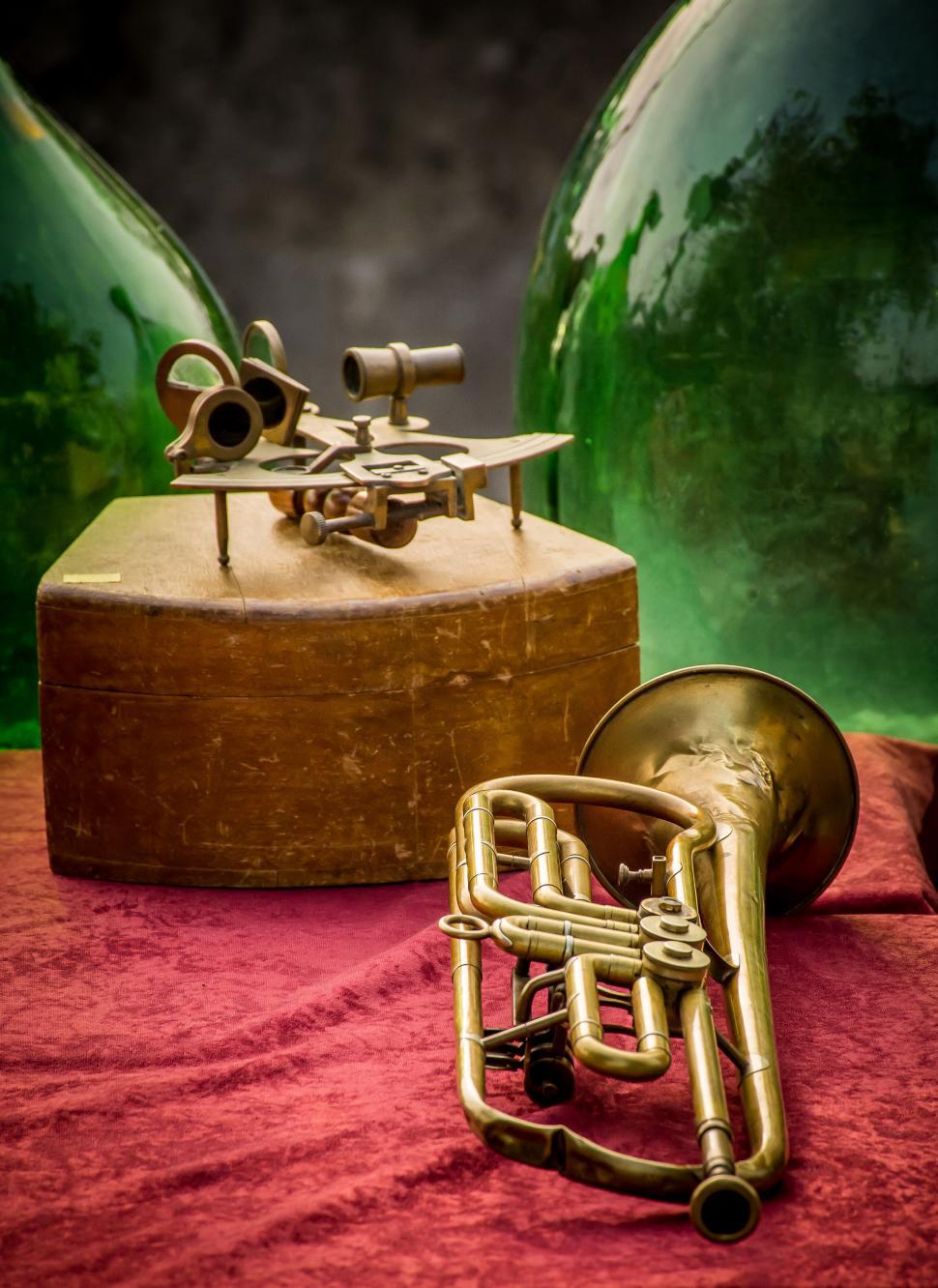 Free Image of Vintage brass instruments on red cloth 