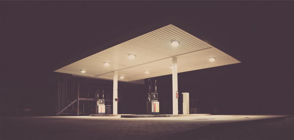 Free Image of Illuminated gas station at night with no people 