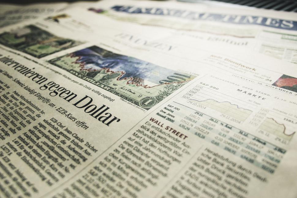 Free Image of Close-up of a newspaper with financial charts 