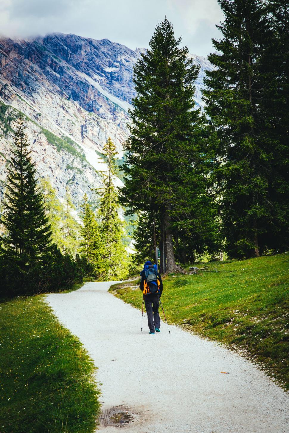 Free Image of Hiker on a scenic mountain trail with backpack 