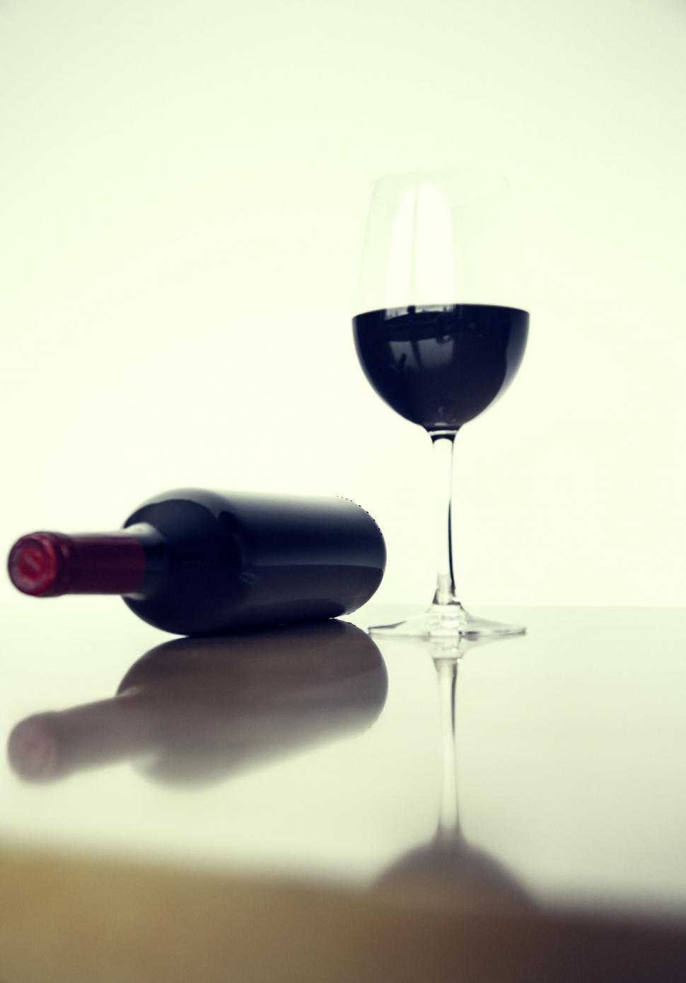 Free Image of Wine bottle and glass silhouette on a table 