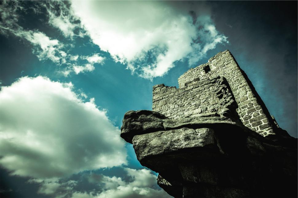 Free Image of Ancient fortress ruins under dramatic clouds 