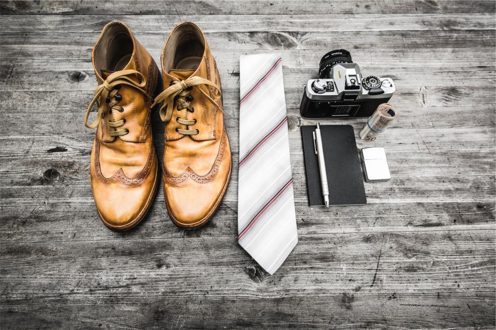 Free Image of Vintage shoes and camera on wooden surface 