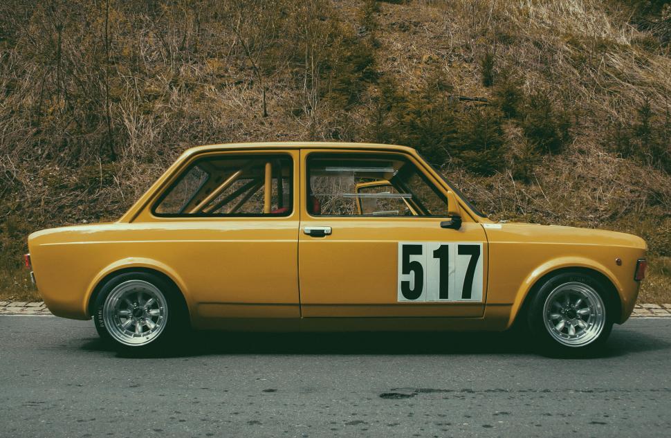 Free Image of Vintage yellow race car with number 517 